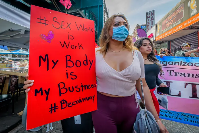 2020/09/18: A participant holding a sign at the march. Sex workers and their allies marched through Jackson Heights and Corona for the Third Annual Slut Walk (Marcha De Las Putas) in Queens, organized by Colectivo Intercultural TRANSgrediendo and Lorena Borjas Community Fund, demanding an end to transphobic violence and discrimination and call for an end to the criminalization and detention of TGNCIQ (transgender, gender non-conforming, gender expansive, intersex, and queer) people.